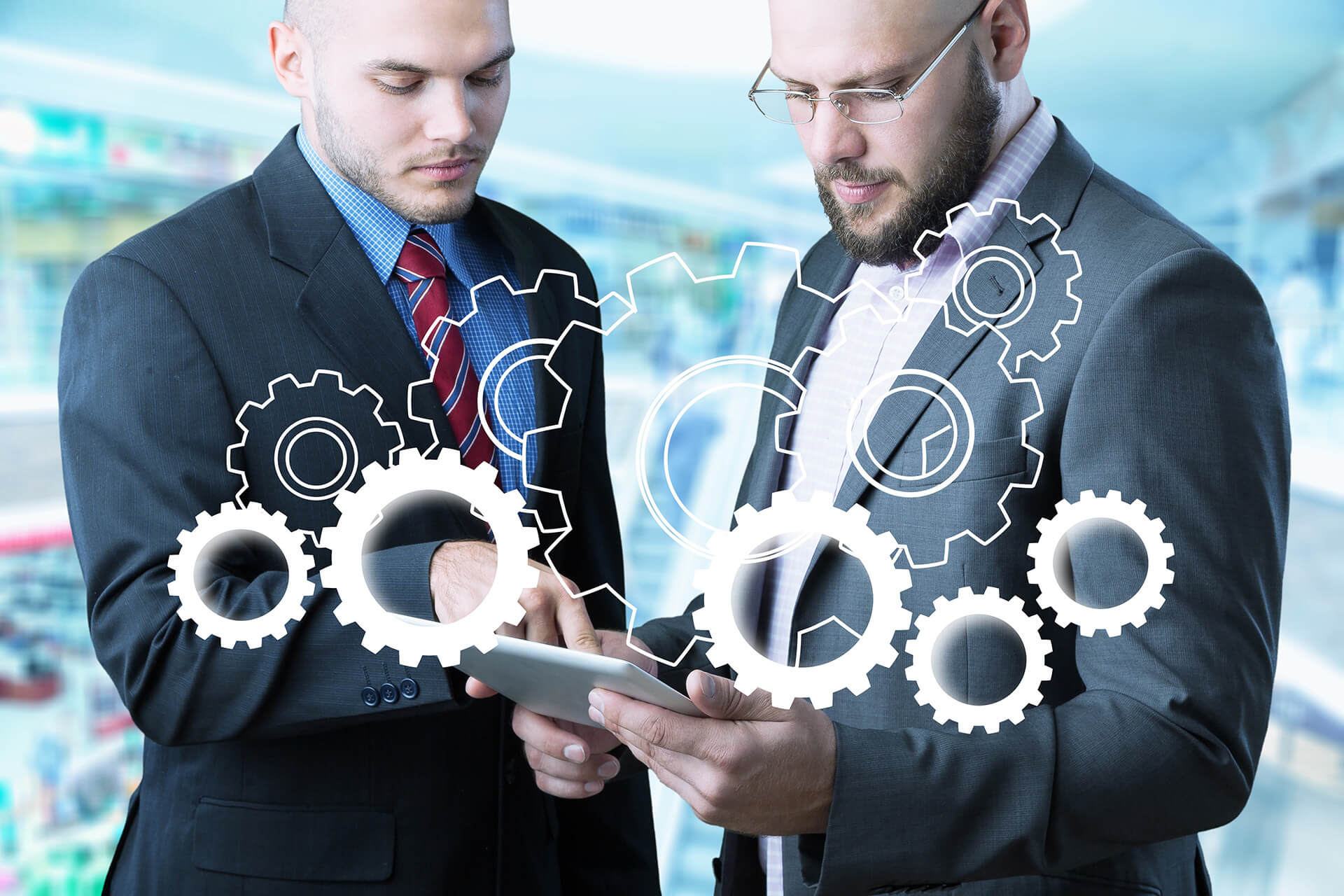 Business team reviewing workflow automation on tablet